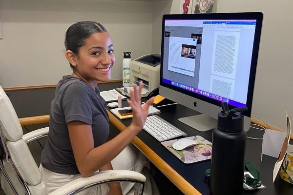 A Young Woman Works At A Computer