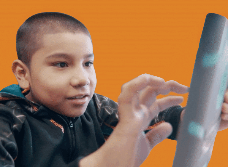 A Boy Explores A Tablet Device
