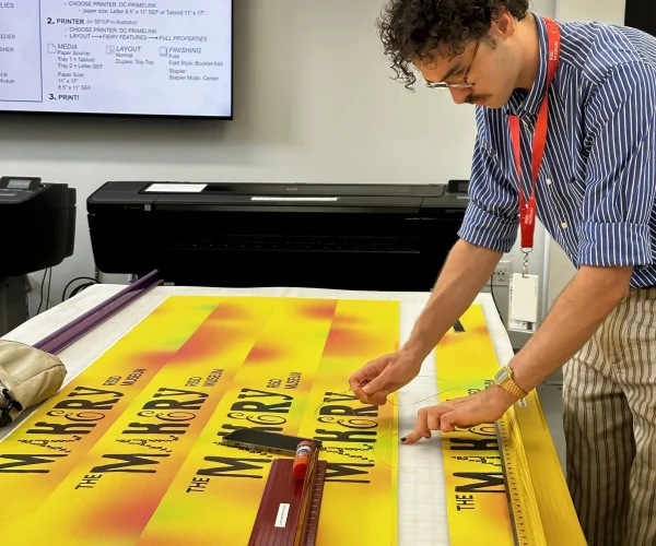 An Intern Inspects Artwork